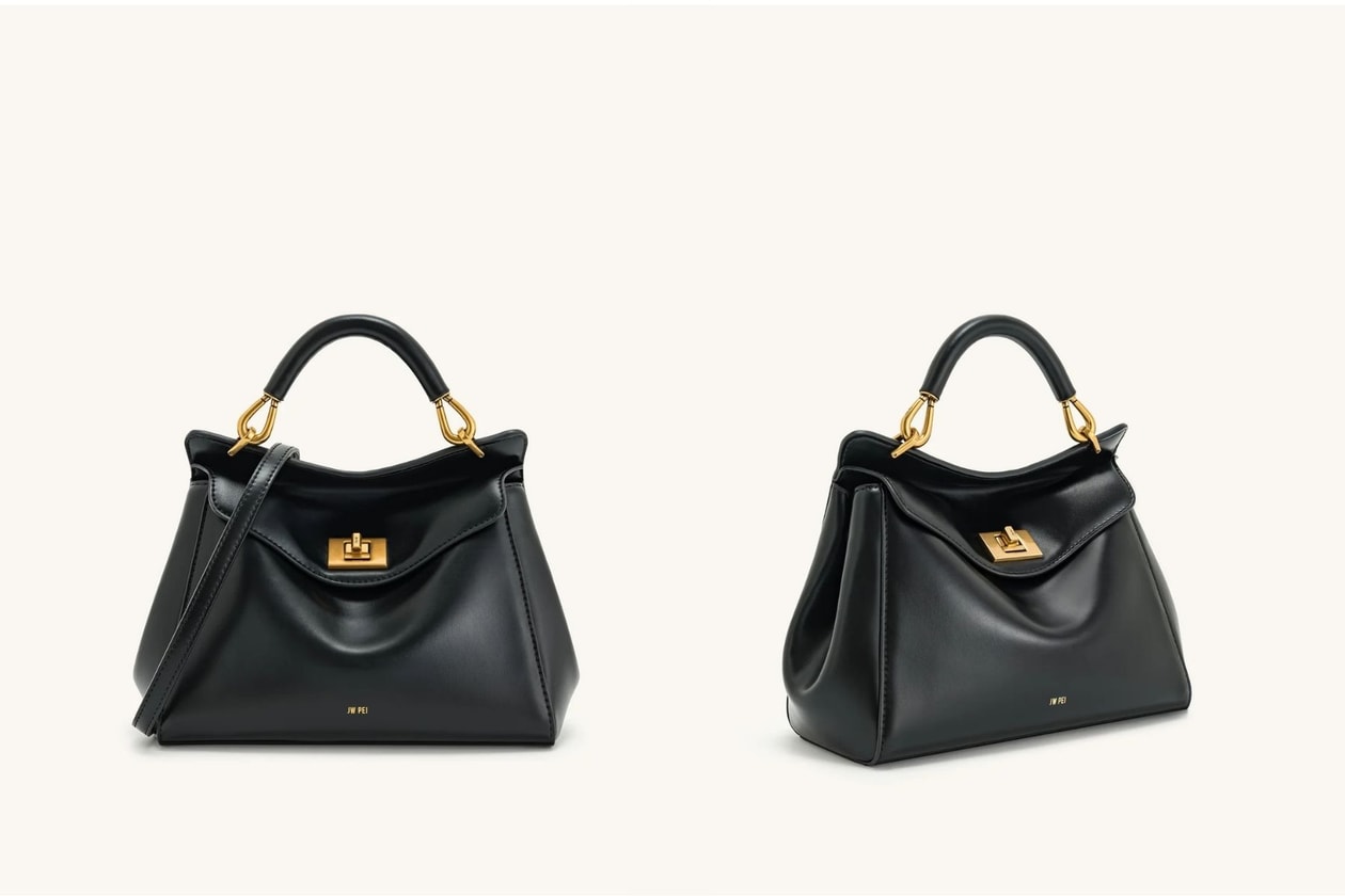 Anne Hathaway wearing a black Gianni Versace dress and carrying the black JW Pei Lucia Bag in New York in 2026