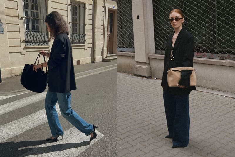 Asian woman wearing a black blazer and wide leg denim jeans walking on the street in Spring 2026.