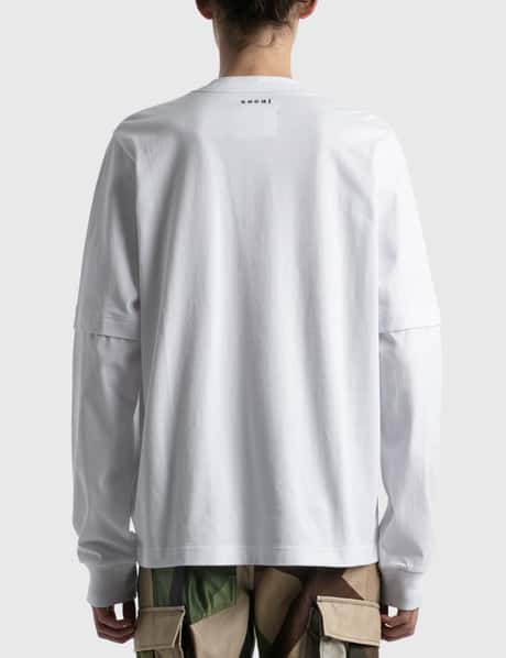 Sacai - KAWS フロックプリント Tシャツ | HBX
