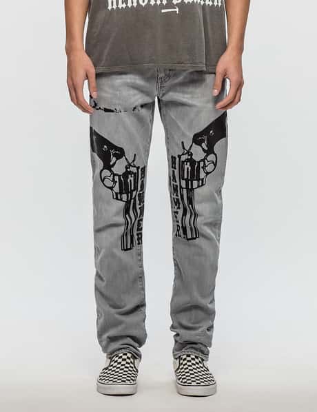 Warren Lotas - Levis 522 Jeans with Black Guns | HBX - Globally 