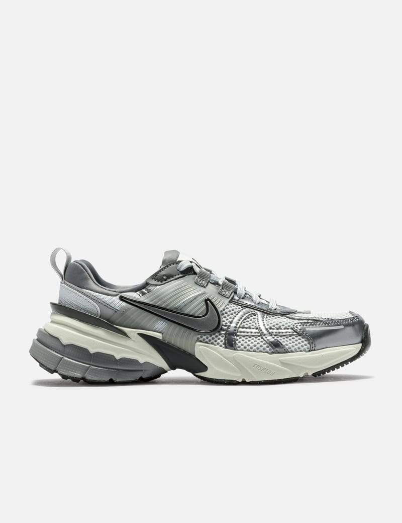 grey nike shoes with black swoosh