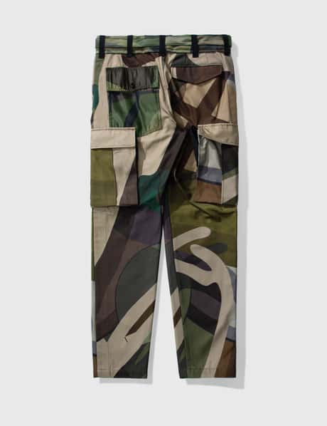 Sacai - KAWS プリントパンツ | HBX - ハイプビースト(Hypebeast)が 