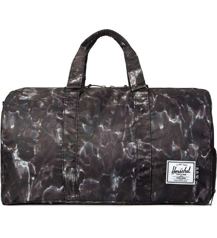 Raised by Wolves x Herschel Supply Co. Water Camo Novel Duffle Bag  Placeholder Image