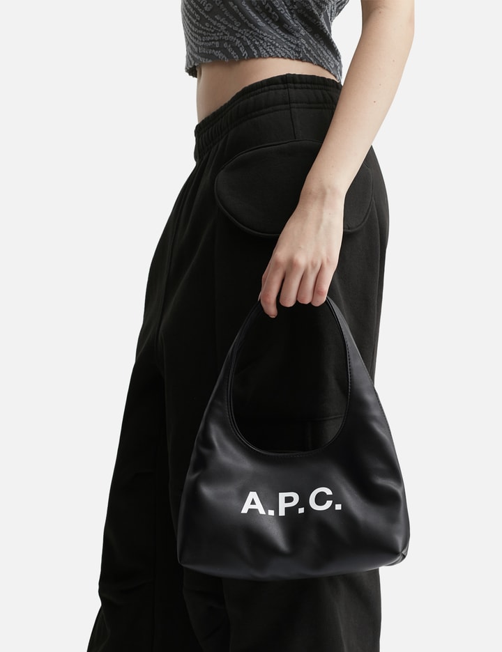 Apc Rounded Silhouette Shoulder Bag With Bold Logo In Black