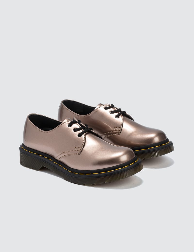 white and rose gold doc martens