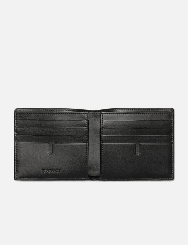 Shop Burberry Embossed Check Bifold Wallet In Black