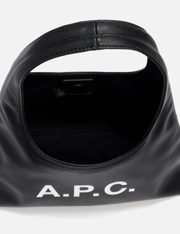 Apc Rounded Silhouette Shoulder Bag With Bold Logo In Black