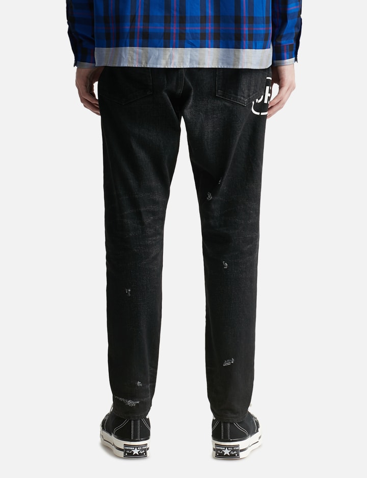 Shop Uniform Experiment Damaged Denim Tapered Pants In Black