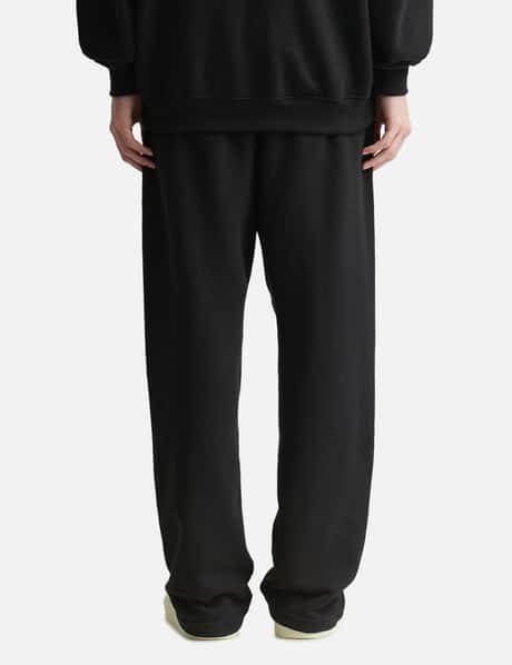 Buy Fear of God Essentials Black Relaxed Sweatpants in Fleece for