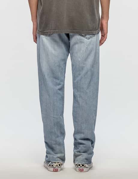 Warren Lotas - Levis 569 Jeans with White Guns | HBX - ハイプ 