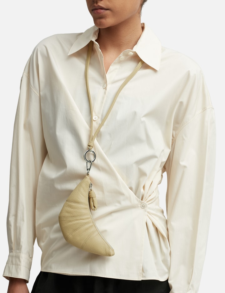 CROISSANT COIN PURSE NECKLACE Placeholder Image