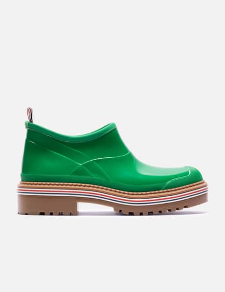 Thom Browne Rubber Garden Boot In Molded Rubber - Light green slip-on with signature striped sole | HBX Thom Browne Rubber Garden Boot In Molded Rubber - Light green slip-on with signature striped sole | HBX