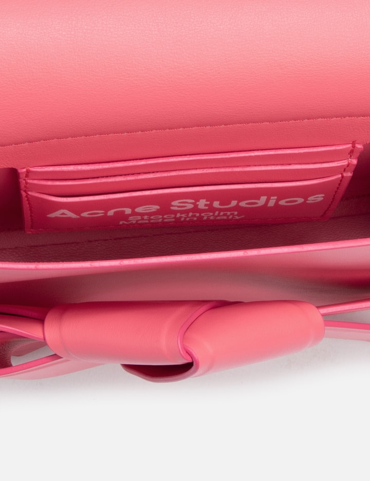Shop Acne Studios Musubi Mini Crossbody Bag In Pink