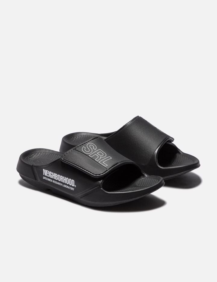 X OOFOS O Oahh Rubber Slides in Black - And Wander