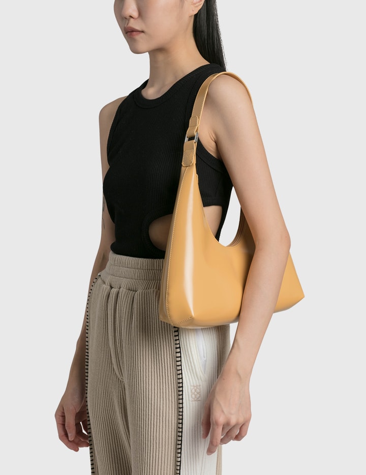 HBX - The BY FAR Amber Semi Patent Leather Bag is now