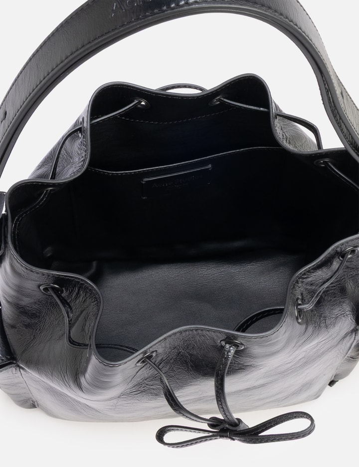Acne Studios Multipocket Mini Crinkled Leather Bucket Bag In Animal Print