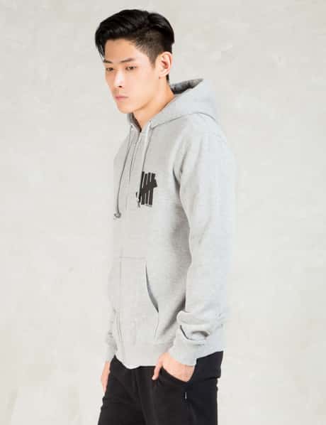 Undefeated - Grey Strike Undefeated Zip Hoodie | HBX - Globally  