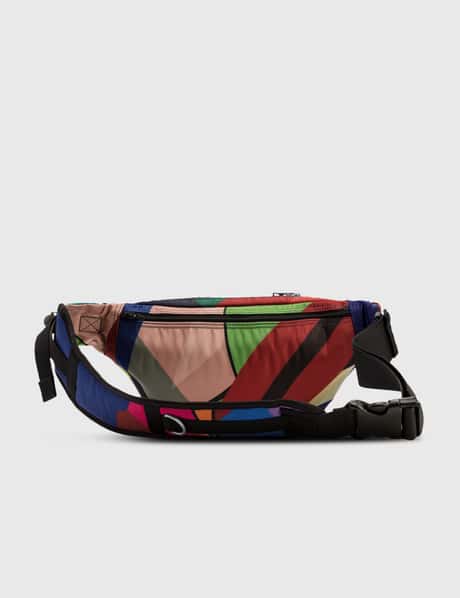 Sacai - KAWS Bum Bag | HBX - Globally Curated Fashion and 
