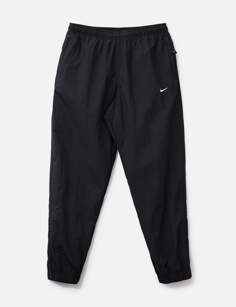 nike swoosh track bottoms