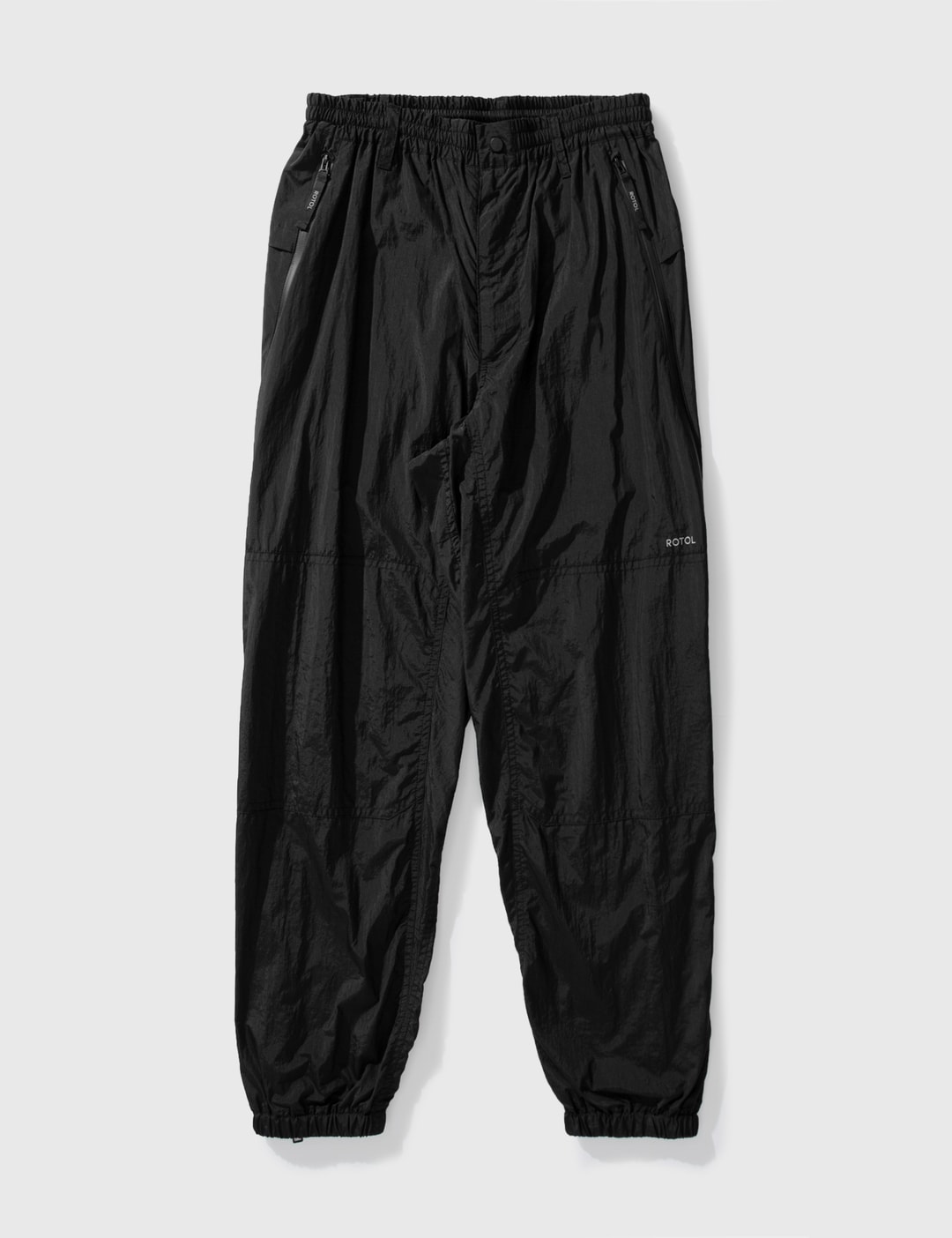 Rotol - TWIST TRACK PANTS | HBX - Globally Curated Fashion and 