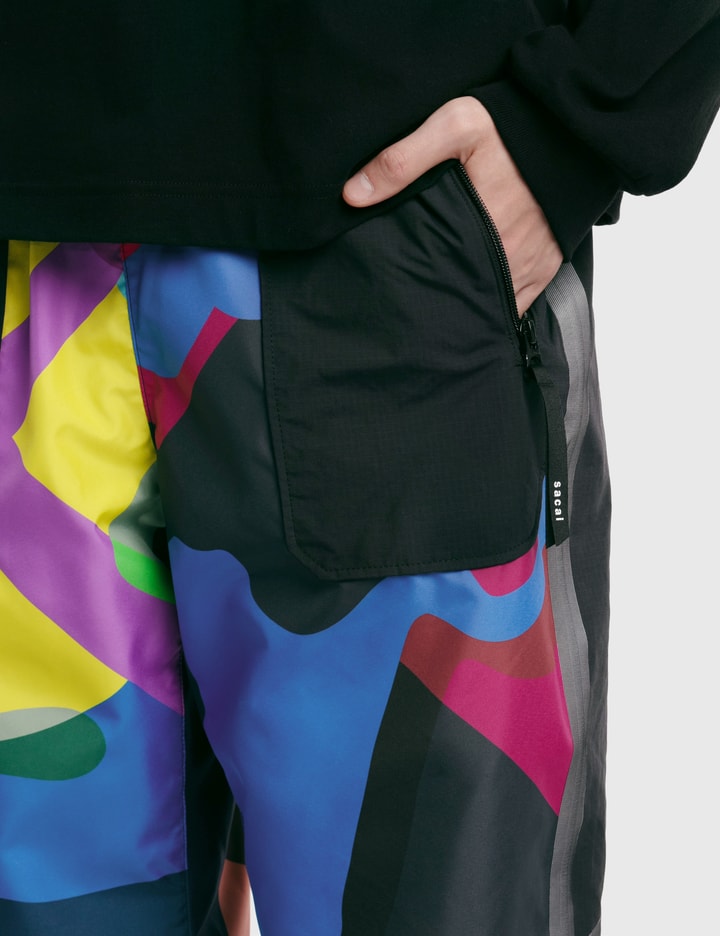 Sacai - KAWS Print Pants | HBX