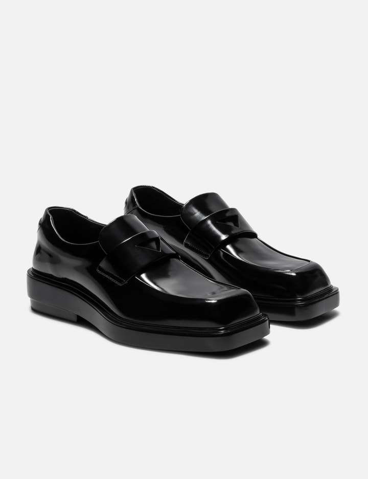 Shop Prada Brushed Leather Loafers In Black