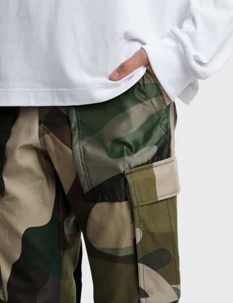 Sacai - KAWS プリントパンツ | HBX - ハイプビースト(Hypebeast)が 