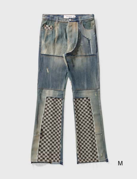 MISBHV Upcycled monogram-patchwork Jeans - Farfetch