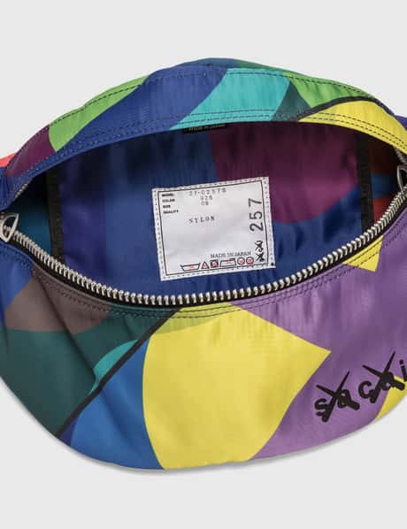 Sacai - KAWS Bum Bag | HBX - Globally Curated Fashion and 