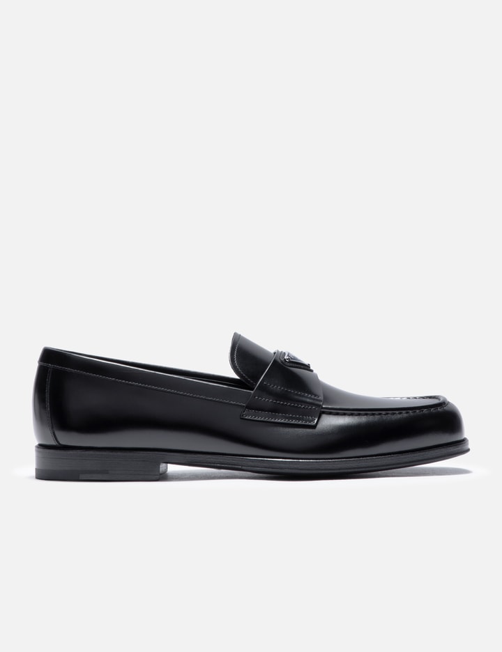 Shop Prada Brushed Leather Loafers In Black