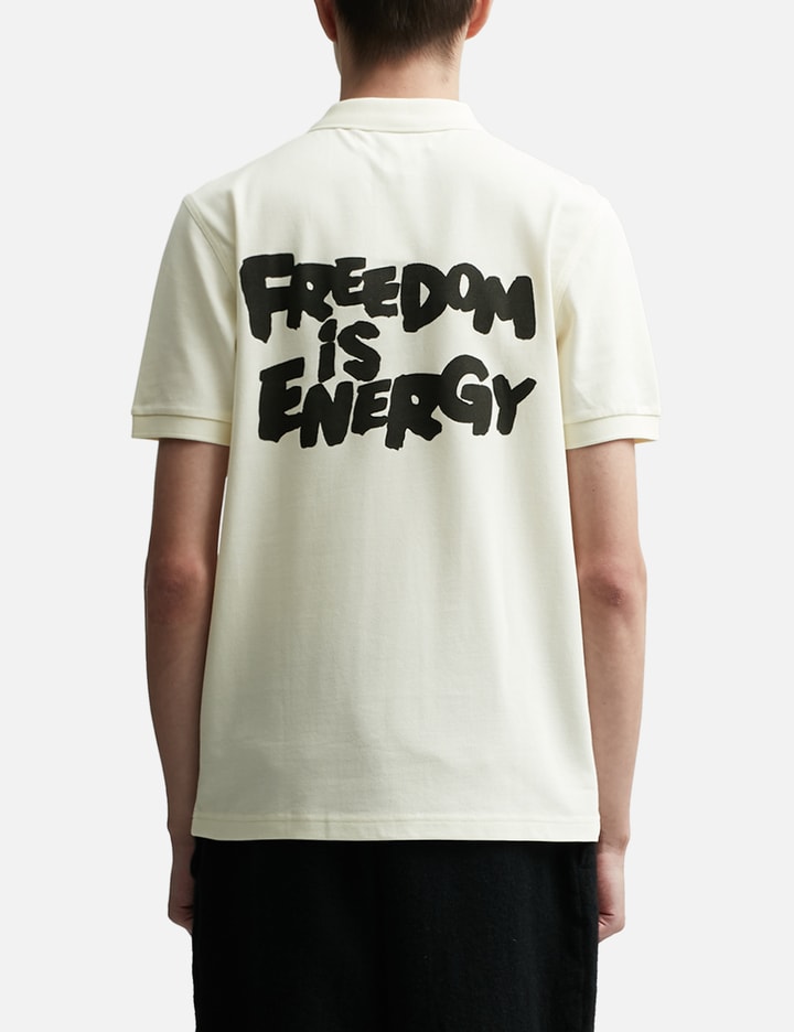 CDG SHIRT X FRED PERRY SS POLO W "FREEDOM IS ENERGY" Placeholder Image