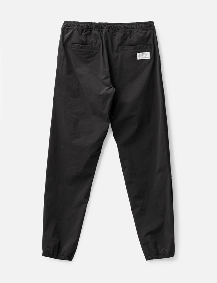 Shop Uniform Experiment Nylon Pants In Black