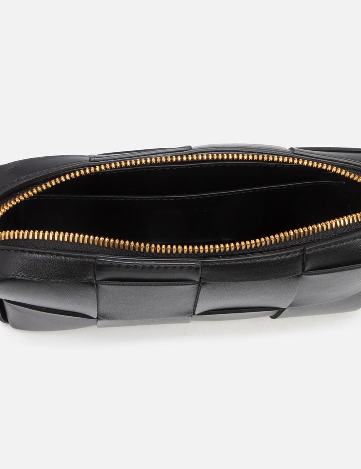 Bottega Veneta® Cassette Belt Bag in Black / Parakeet. Shop online