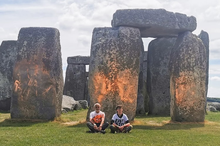 Just Stop Oil Activists Drench Stonehenge in Orange Powder Paint