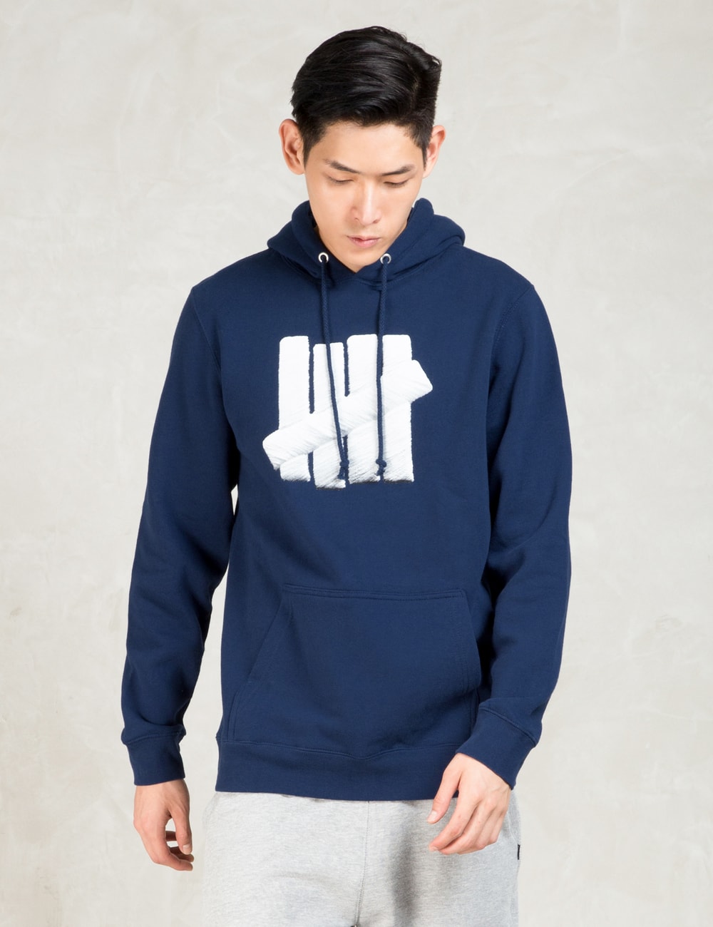 Undefeated - Navy Embroidery Strike Hoodie | HBX