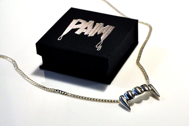 perks and mini fang necklace