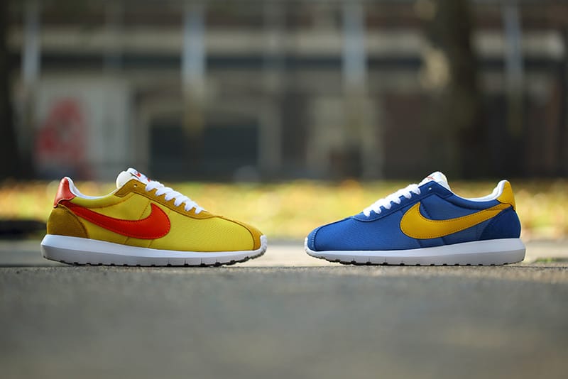 Nike roshe blue and gold best sale