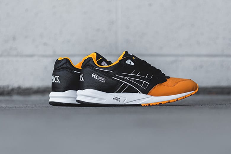 Asics gel saga black on sale orange