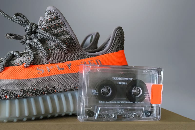 Black yeezys cheap orange stripe