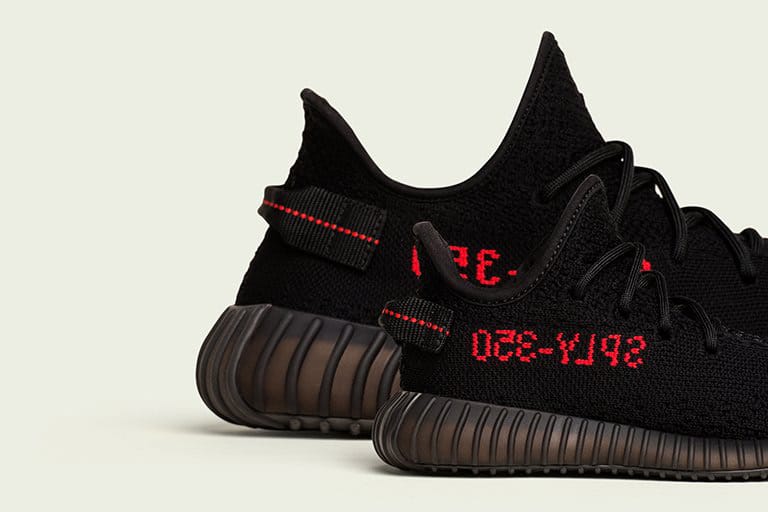 Black yeezys clearance with red writing