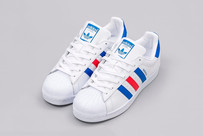 Adidas white with store blue and red stripes