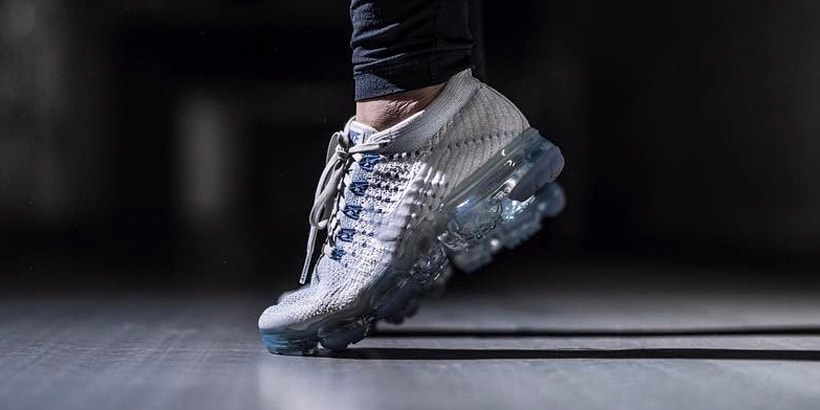 white vapormax with blue bottom