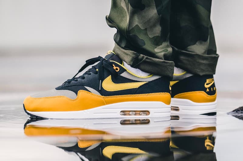nike air max plus gold on feet