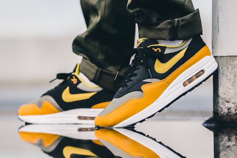 nike air max plus gold on feet