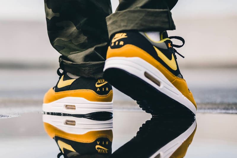 nike air max plus gold on feet