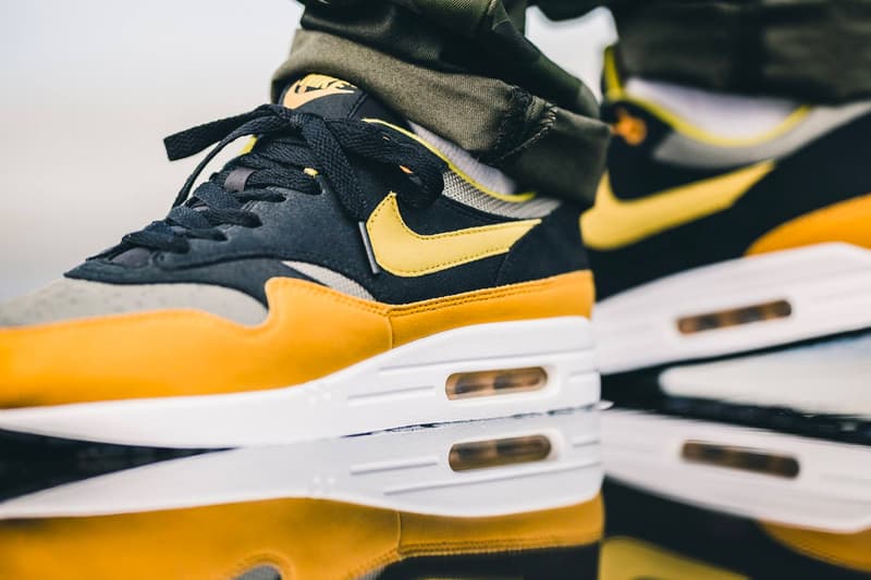 nike air max plus gold on feet