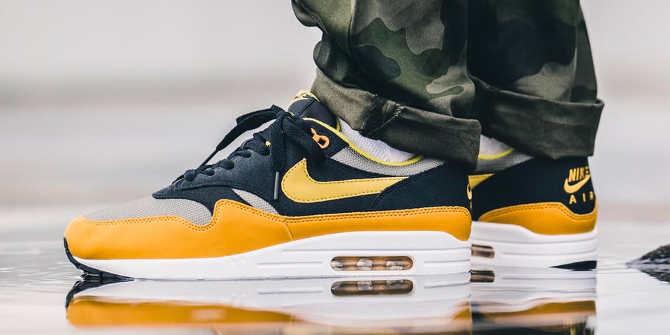 nike air max plus gold on feet