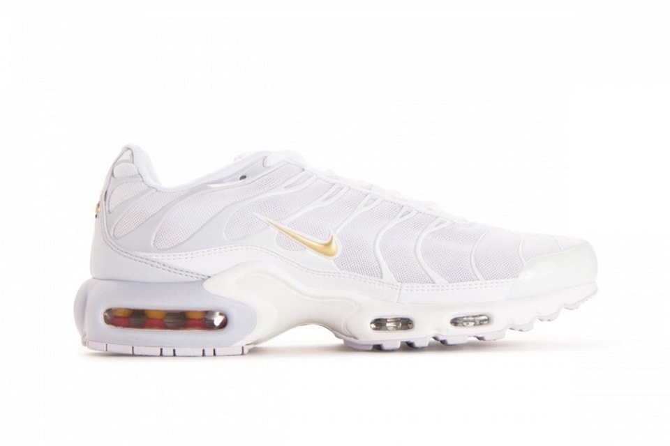 gold and white nike air max plus