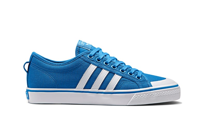 Adidas originals nizza canvas trainers outlet in white and blue