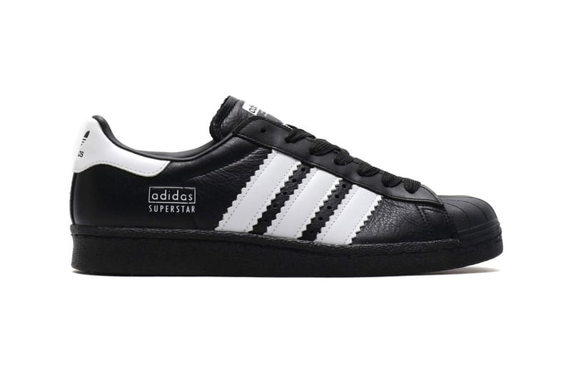 Black adidas 2024 with white stripes